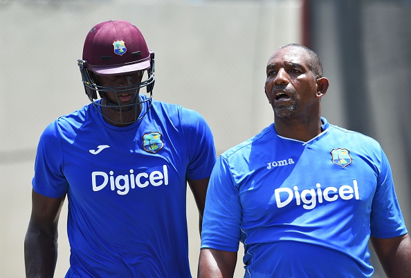 Phil Simmons and Jason Holder having a chat.