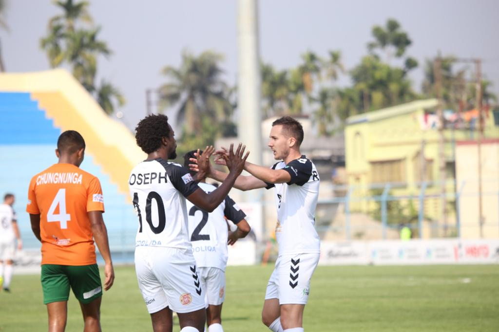 Sporting players celebrate after scoring a goal.